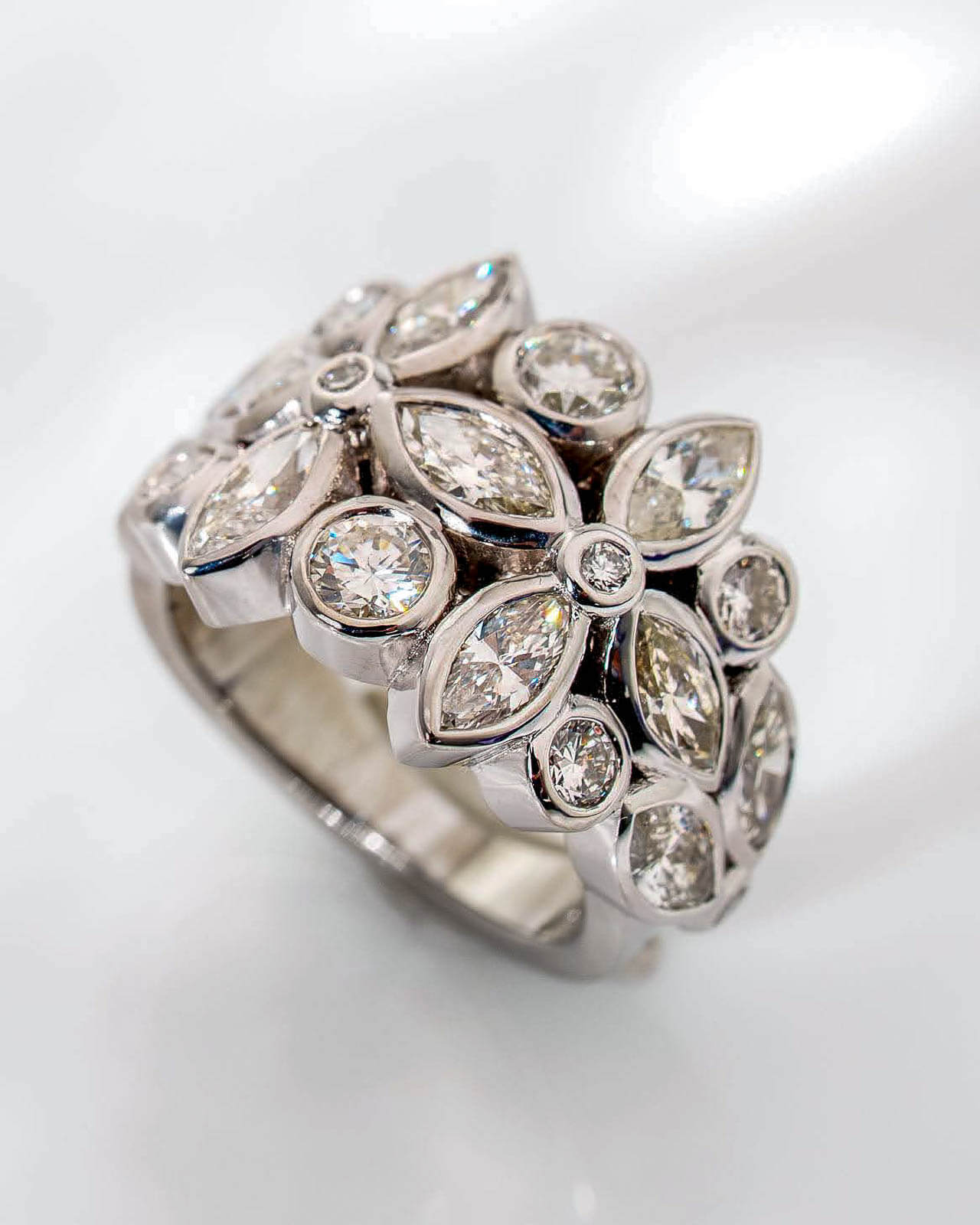 White gold cluster ring with marquise and round diamonds in a floral layout — Sara Gallo Custom Jewelers, Lancaster, PA.